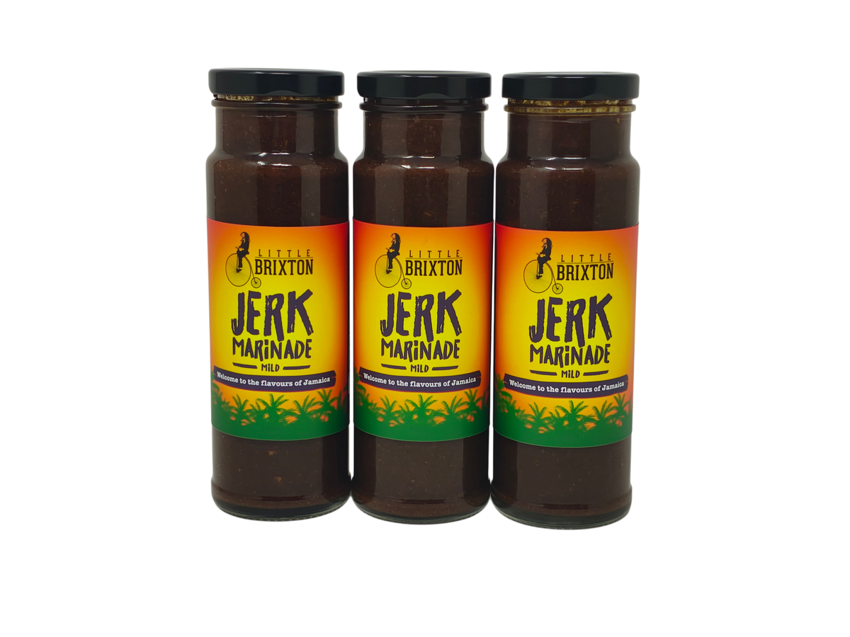 Three glass jars of Little Brixton Jerk Marinade with vibrant yellow, orange, and green labels on a white background.