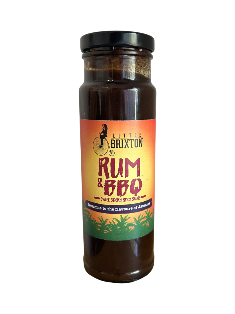 Little Brixton Rum and BBQ sauce in a glass bottle with a vibrant orange and green Jamaican-inspired label.